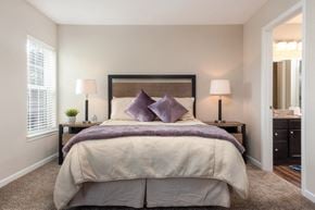 Kent apartment for rent - a bedroom with a large bed and a mirror