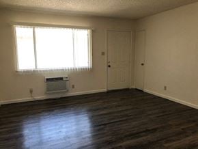 Modesto apartment for rent - an empty room with a door and a window
