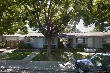 Modesto apartment for rent - a house with a tree in the front of it