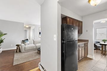 Atlantic City apartment for rent - a kitchen with a refrigerator and a living room with a couch
