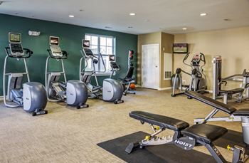 Fitness center with cardio and strength equipment parkside commons apartments chelsea, ma