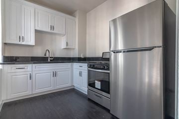 Los Angeles apartment for rent - a kitchen with stainless steel appliances and white cabinets