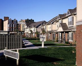 Rochester townhouse for rent - a row of houses with a sign in front of them