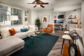 La Mesa apartment for rent - La Mesa, CA Apartments for Rent - The District - Living Room with a Ceiling Fan, Wood-Style Floors, and Open Floor Plan