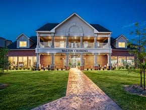 Bentonville apartment for rent - the facade of the valley crossing clubhouse at night