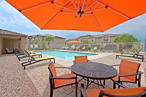 Glendale townhouse for rent - our apartments have a pool and a patio with chairs and tables