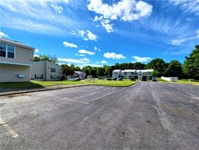 Clyde apartment for rent - a large parking lot with houses on both sides of it