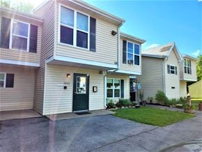 Clyde apartment for rent - a white house with a black door on a driveway
