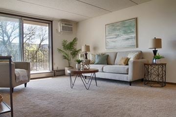 Hopkins multi-family for rent - a living room with a couch and a table