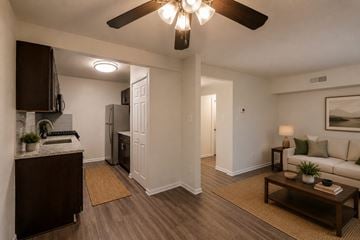 Alexandria apartment for rent - A living room with a brown coffee table and a white couch.