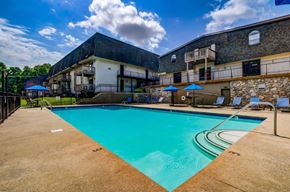 Nashville apartment for rent - a swimming pool with a building in the background