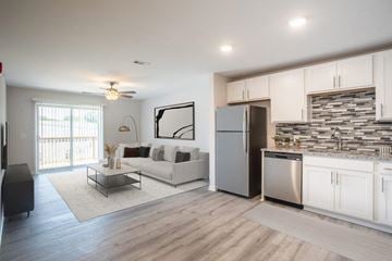Nashville apartment for rent - a kitchen and living room with a refrigerator and a couch