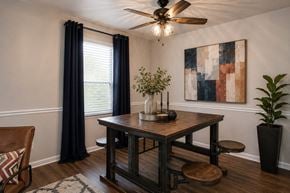Nashville townhouse for rent - A dining room with a wooden table and chairs.