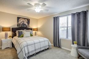 Nashville apartment for rent - a bedroom with a bed and a ceiling fan