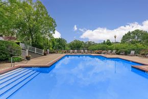 Presto apartment for rent - a swimming pool with trees in the background