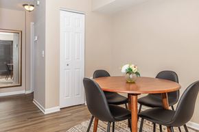 Loveland apartment for rent - a dining room with a wooden table and chairs