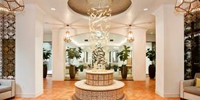 San Diego apartment for rent - A large, modern sculpture is the centerpiece of a spacious, well-lit lobby.