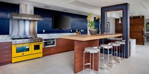 San Diego apartment for rent - A kitchen with a yellow oven and a blue wall.