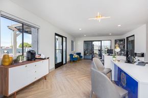 Mesa apartment for rent - A modern office space with a reception desk and chairs.