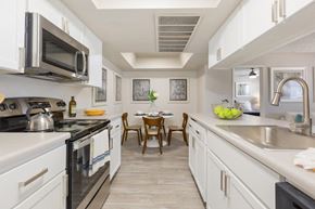 Mesa apartment for rent - Our two-bedroom apartments in Mesa, AZ, offer an open-concept Kitchen and dining room. The kitchen has white cabinets and white countertops with pewter-like hardware: stainless steel microwave and ele