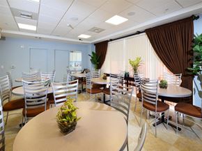 Miami apartment for rent - a dining room with tables and chairs