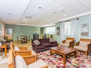 Miami apartment for rent - a living room with couches and chairs and a table
