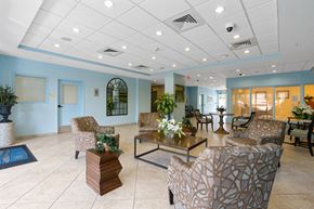 Miami apartment for rent - a lobby with couches and chairs and a coffee table