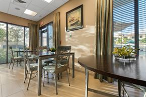 Naranja apartment for rent - a dining room with a table and chairs and windows