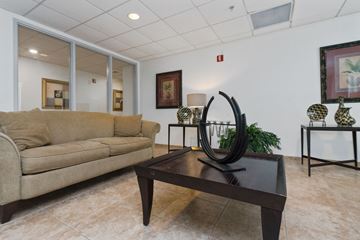 Miami apartment for rent - a living room with a couch and a coffee table