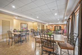 Miami apartment for rent - a dining room with tables and chairs in a restaurant