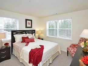East Wareham apartment for rent - a bedroom with a bed and a chair and a window