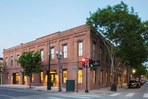 New Orleans apartment for rent - a brick building on the corner of a city street