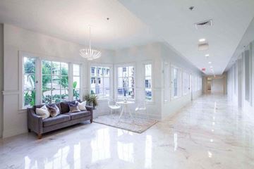 New Orleans apartment for rent - a large white living room with a couch and a table