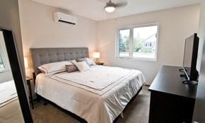 Brandon apartment for rent - a bedroom with a bed and a tv