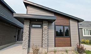 Brandon apartment for rent - a house with a wood and stone facade and a wooden door