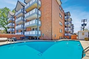 Denver apartment for rent - View of a swimming pool with the Brit apartments in the background