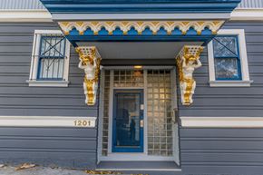 San Francisco apartment for rent - A blue door with a gold number 1201 on the wall.