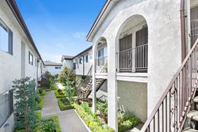 Downey apartment for rent - a row of apartments with stairs and balconies