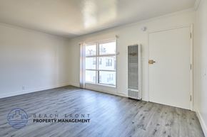 Compton apartment for rent - A room with a window and a door, managed by Beach Front Property Management.