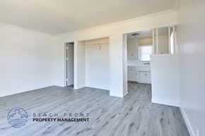 Compton apartment for rent - A room with a logo of Beach Front Property Management on the floor.