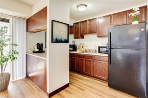 Alexandria apartment for rent - a kitchen with stainless steel appliances and wooden cabinets