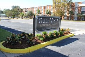 Pascagoula apartment for rent - a sign in a parking lot in front of a building
