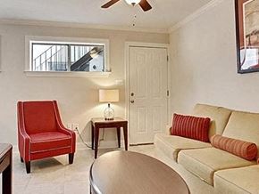 New Orleans apartment for rent - a living room with a couch and a chair and a table