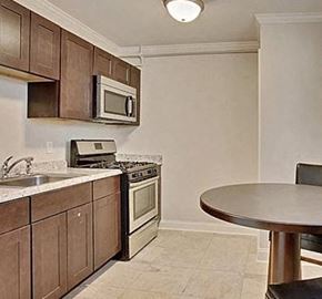 New Orleans apartment for rent - a kitchen with a stove microwave and a table