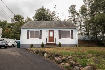 Hamden apartment for rent - a white house with a brown door and a gravel driveway
