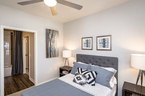San Antonio apartment for rent - a bedroom with a bed and a ceiling fan