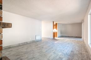 Portland apartment for rent - an empty living room with wood floors and white walls