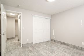 Portland apartment for rent - an empty room with a white door and a door to a closet