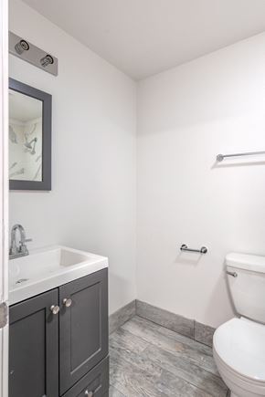 Portland apartment for rent - an empty bathroom with a toilet sink and mirror
