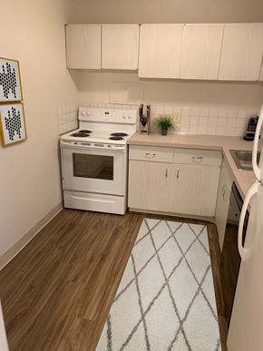 East Cleveland apartment for rent - a kitchen with white appliances and white cabinets